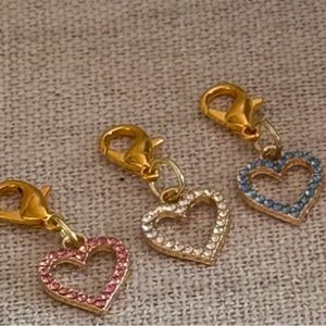 Brand-new, 6 charms 3 gold and three charms with silver pink clear blue
